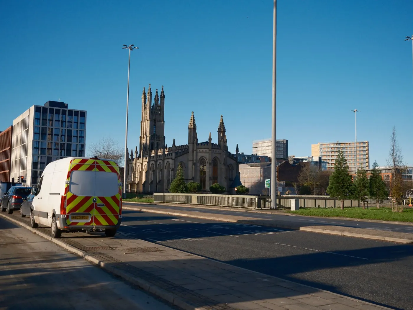 A gothic-style church building in an urban street